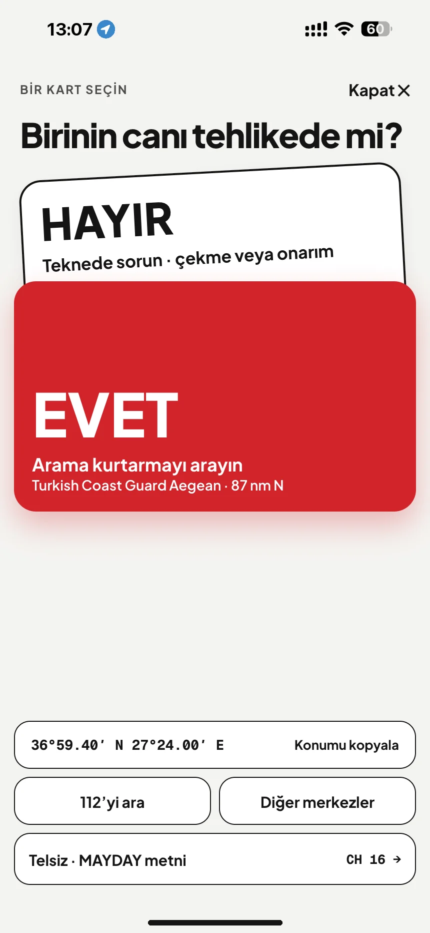 Denizde SOS: birinin hayatı tehlikede mi? Evet, Sahil Güvenlik Ege Bölge Komutanlığı hattını arar; hayır, yol yardımını açar · VesselSOS
